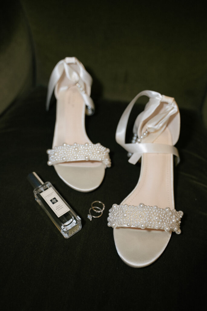 Bride's shoes, rings, and perfume for her Depot Minneapolis wedding