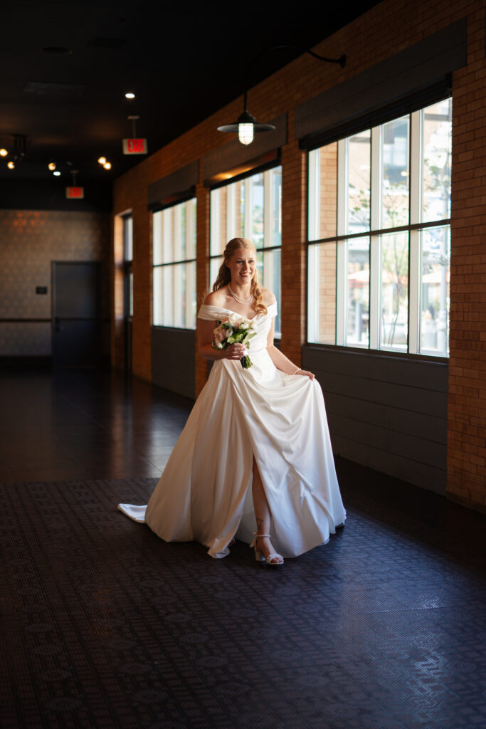 Bride getting ready for her first look at the Depot Minneapolis, featuring florals from Leitner's Garden Center