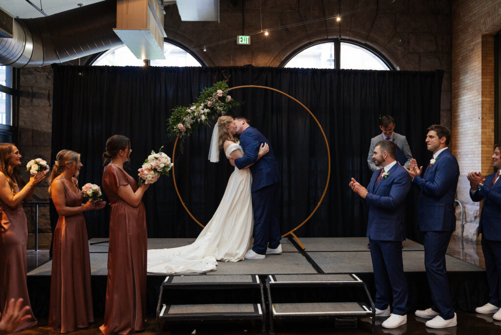 Couple's first kiss at their The Depot Minneapolis wedding