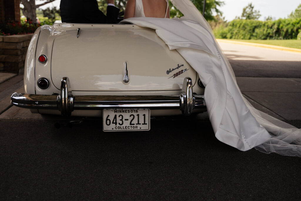 Saint Paul Town and Country Club wedding featuring a 1960's Austin Healey 3000 convertible