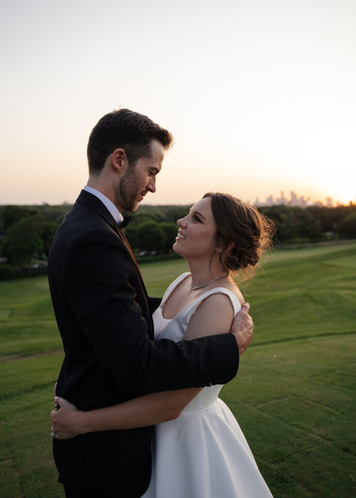 Saint Paul Town and Country Club wedding golden hour portraits featuring the Saint Paul skyline