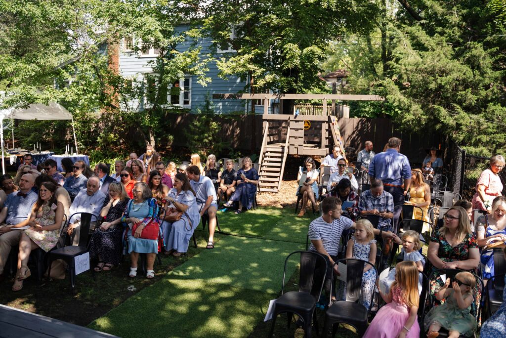 Guests seated at a backyard wedding in Saint Paul, Minnesota