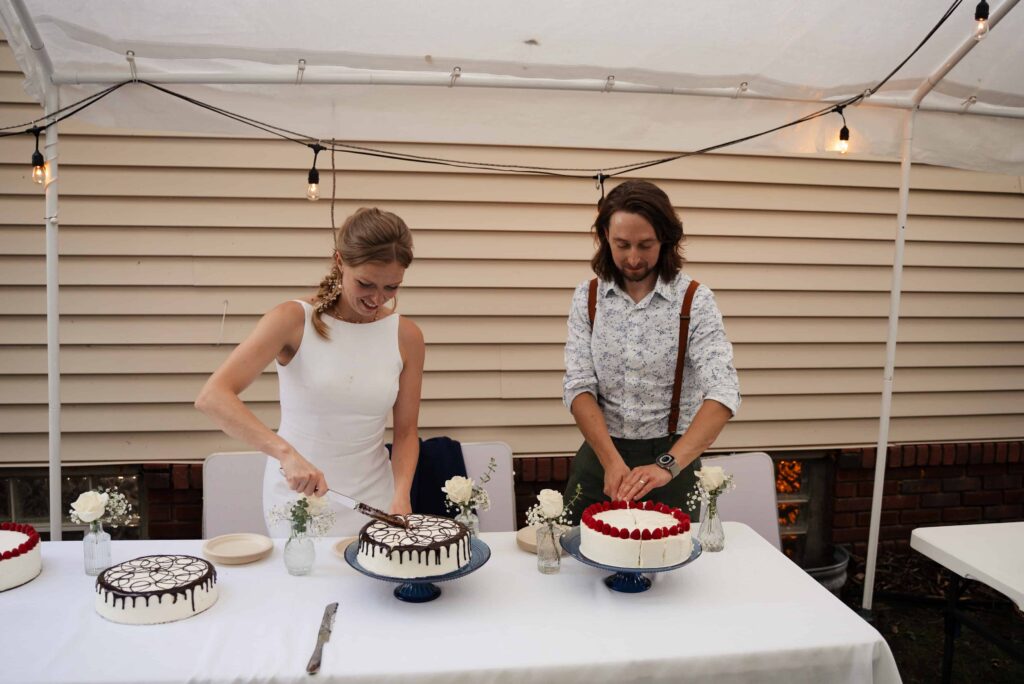 Cake cutting during this backyard wedding in Saint Paul, Minnesota