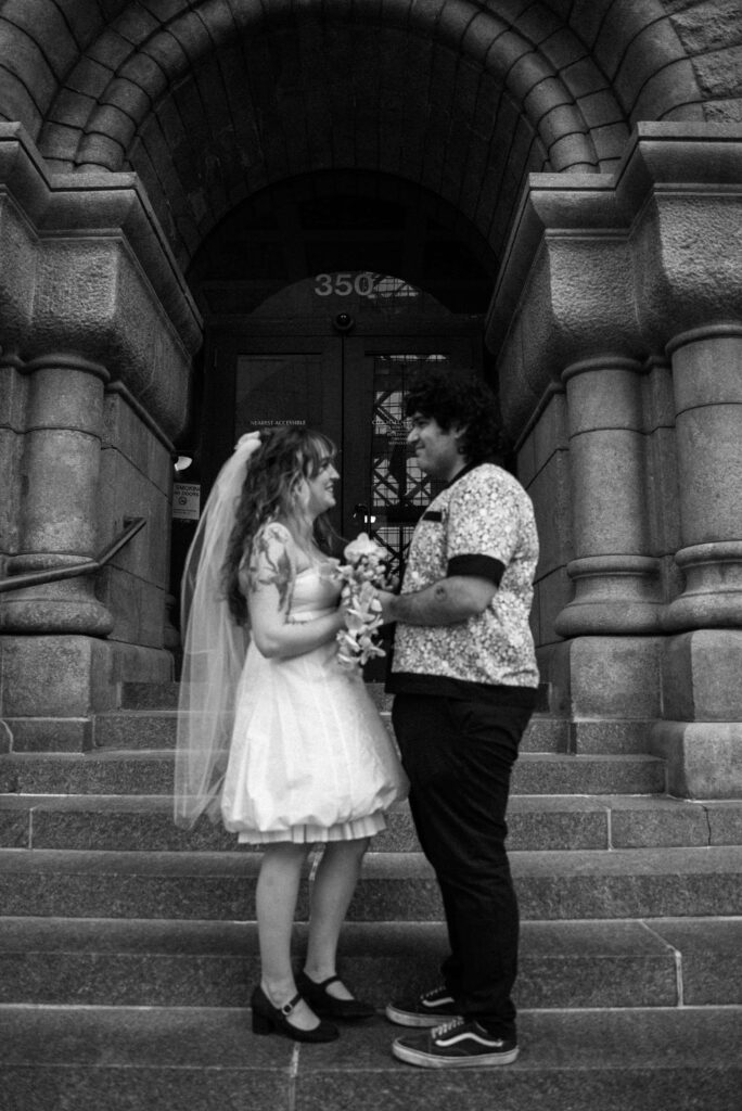 Elopement couple on the steps of Minneapolis City Hall in downtown Minneapolis, Minnesota