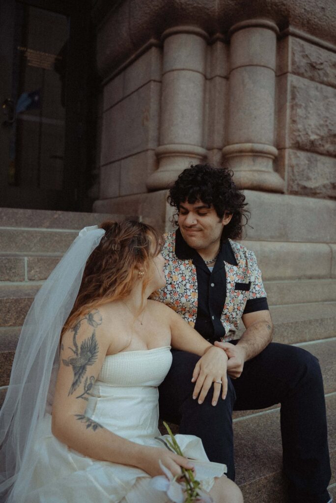 Alternative couple on the steps of Minneapolis City Hall during their elopement