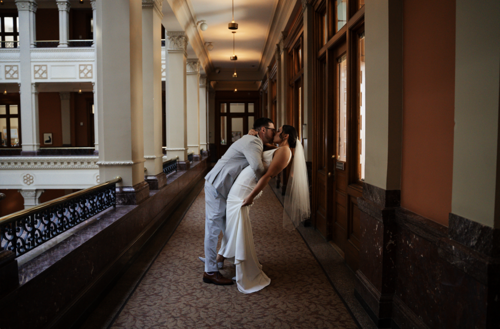 Bride and groom in the hallway of the Landmark Center in Saint Paul, Minnesota